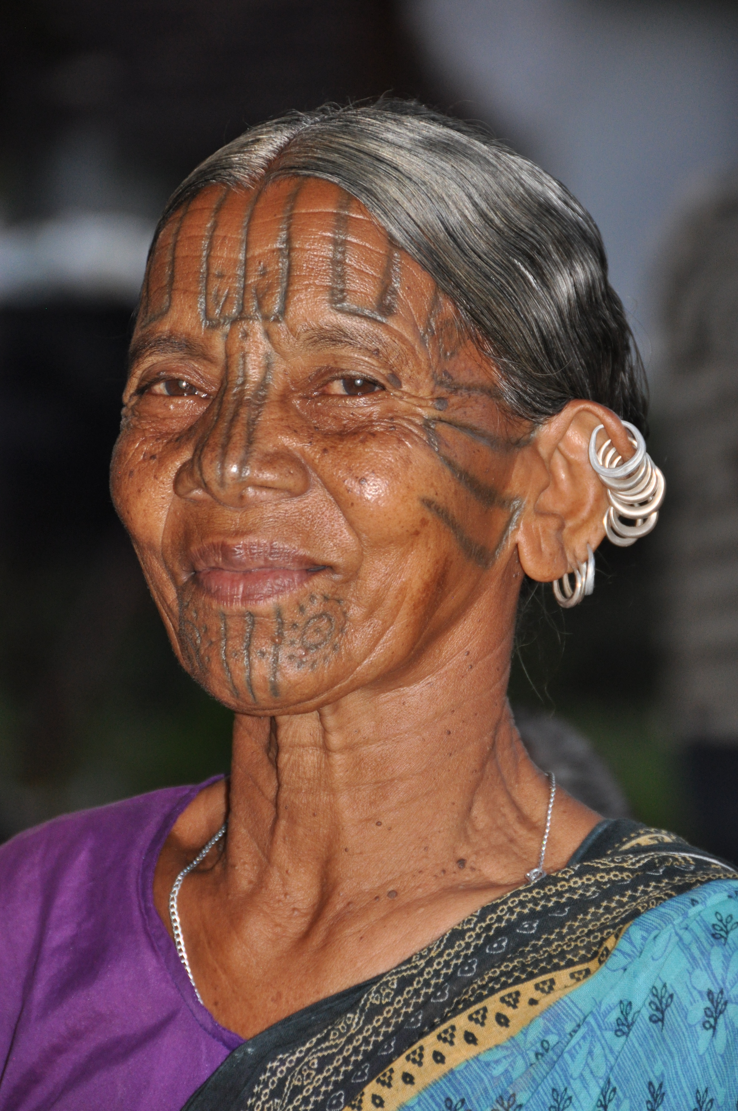 woman with a tattooed face